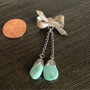 Elegant Silver Bow Pin with Turquoise Accents